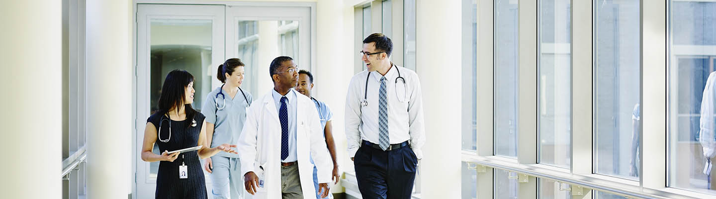 medical team walking down hallway