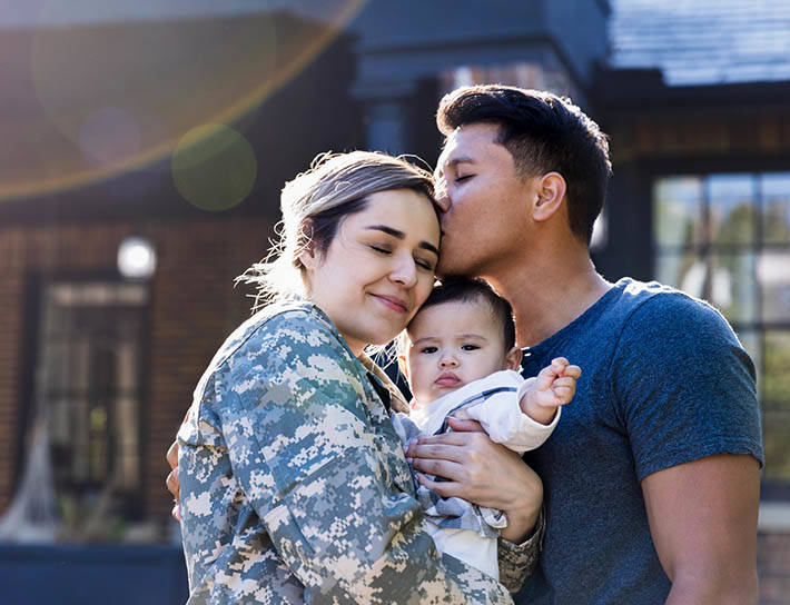 Man kisses soldier wife